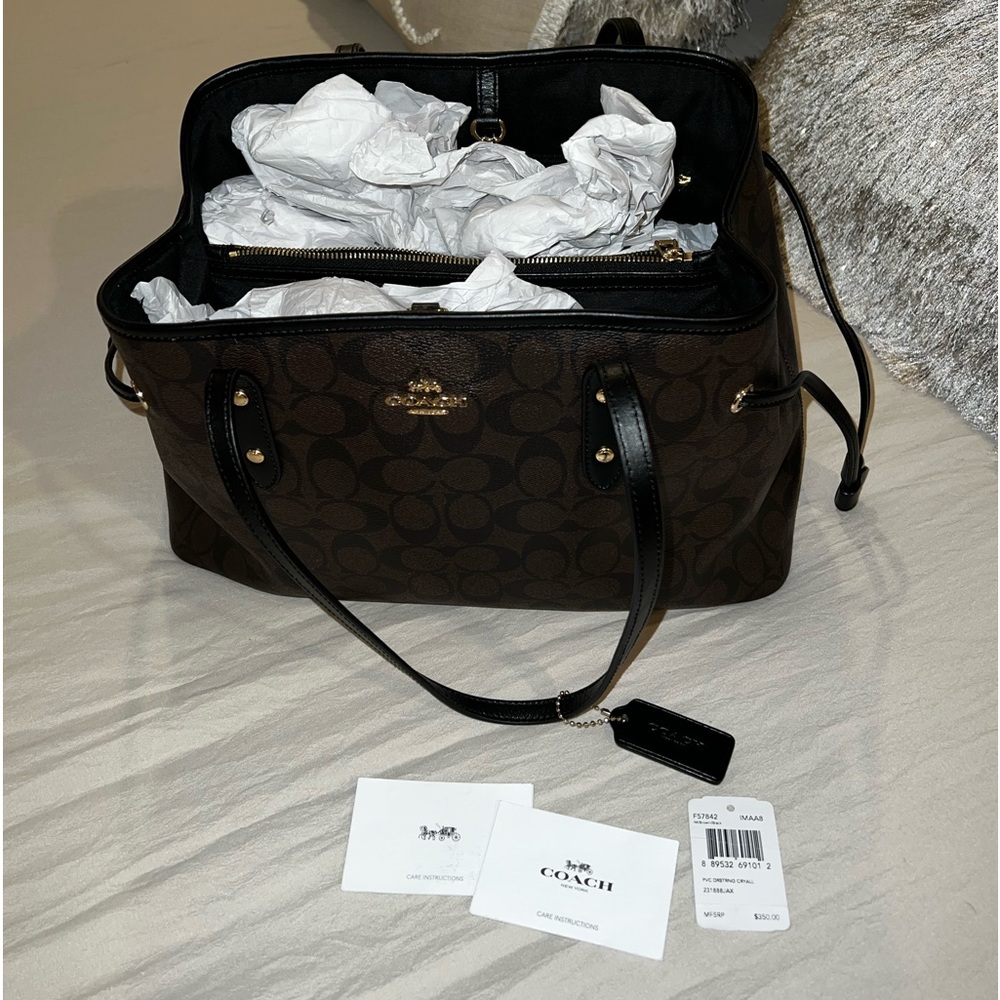 Coach black and brown drawstring sides handbag.